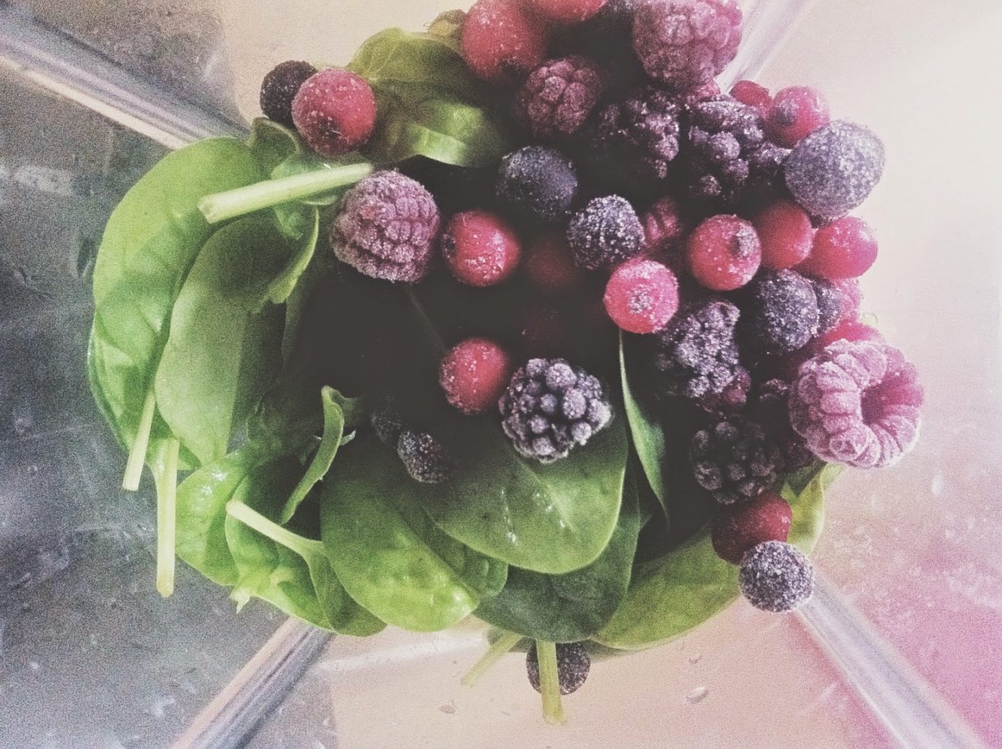 Spinach and berries in a blender