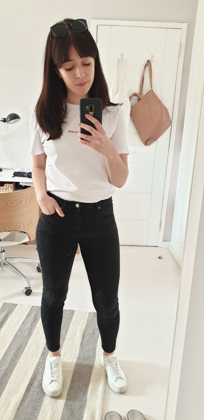 White t-shirt with black jeans and white sneakers