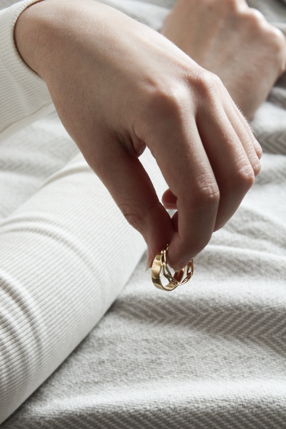 Hand holding gold rings