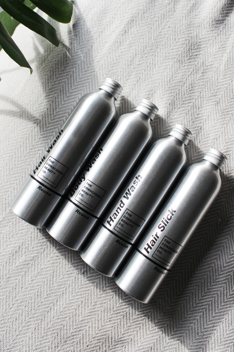 Refillable metal bottles from Conscious Beauty Co.