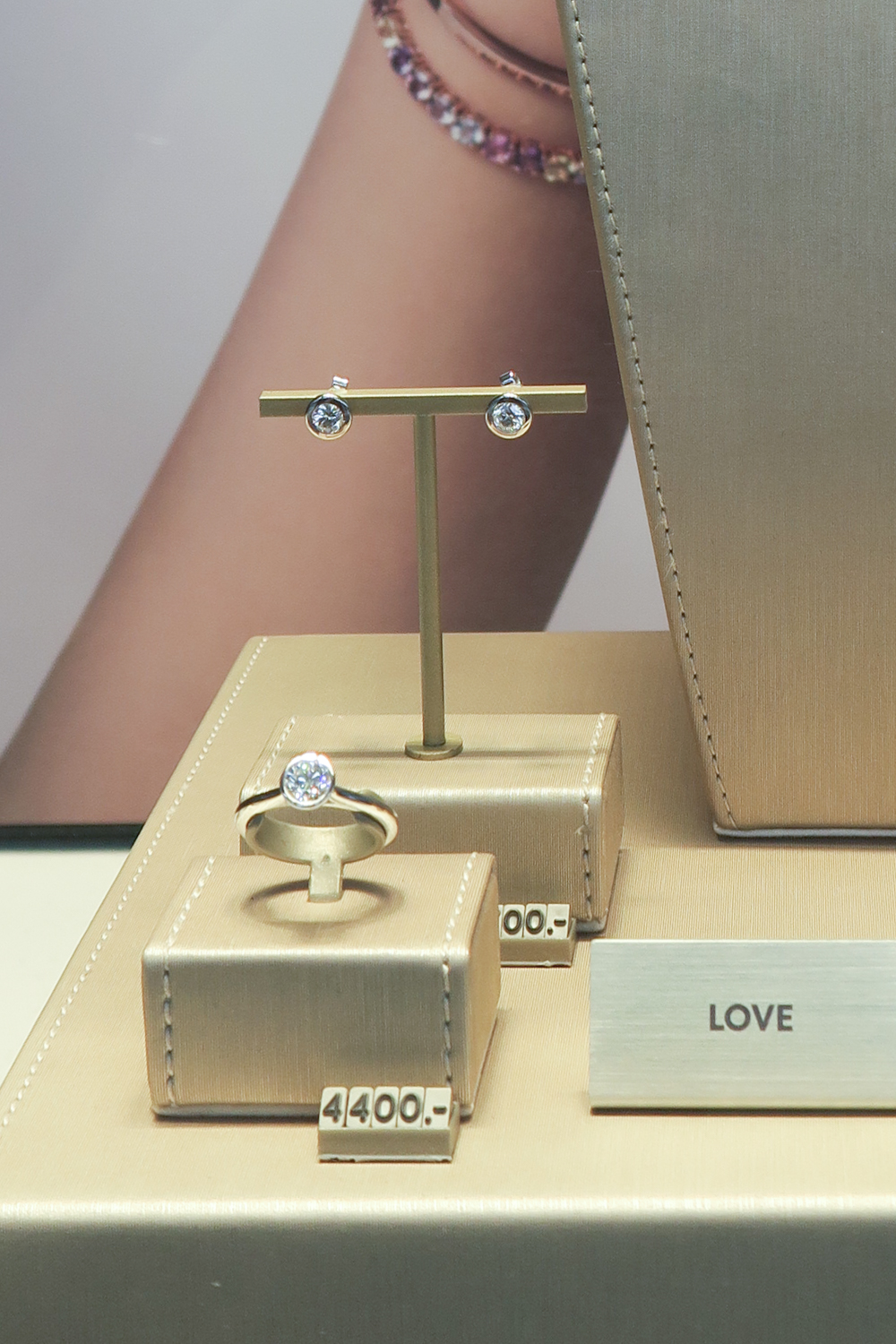 Close-up of Love Diamond Earrings and Ring