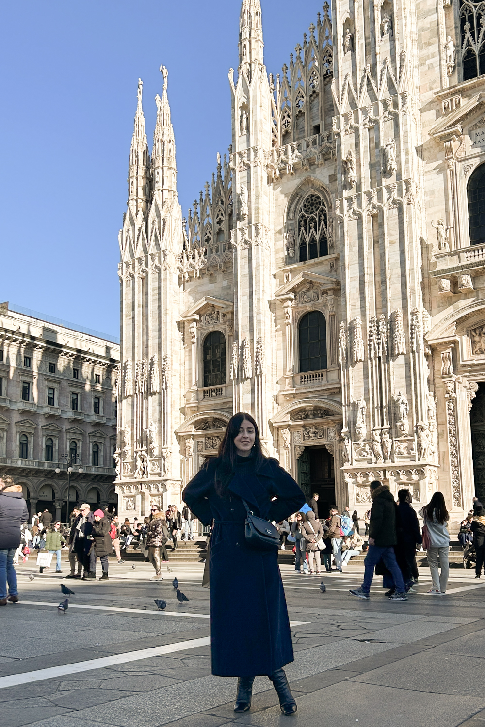 Besma stands in Piazza del Duomo, Milan