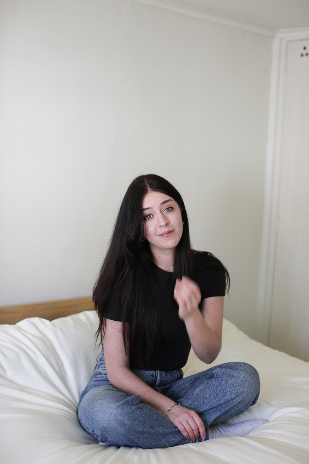 Besma sits on new bedding by Panda London