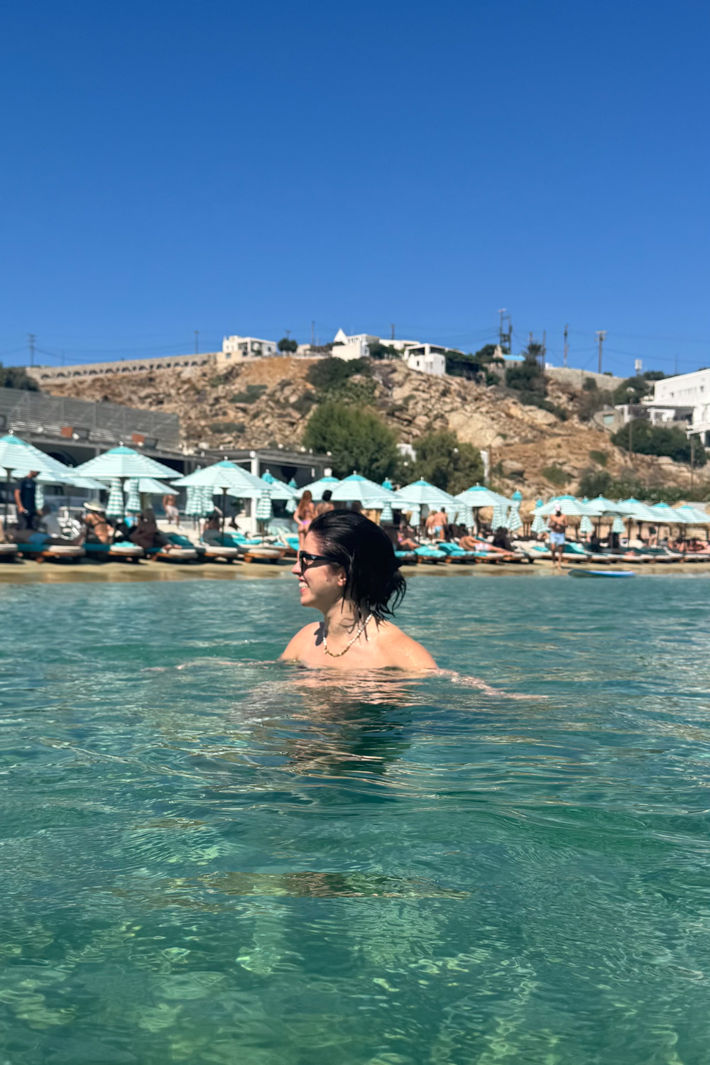 Besma swimming at Nammos Beach Club