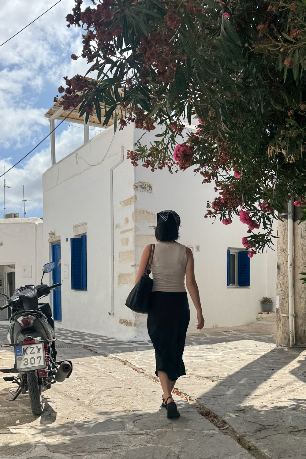 Besma walking on street in Paros Town
