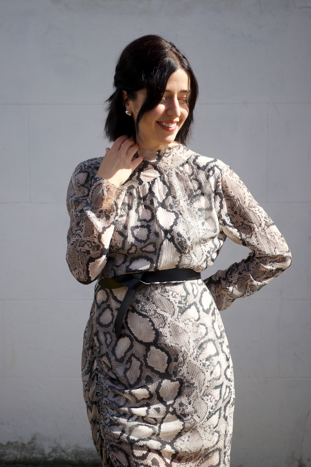 Besma wears silk evening dress with snake print