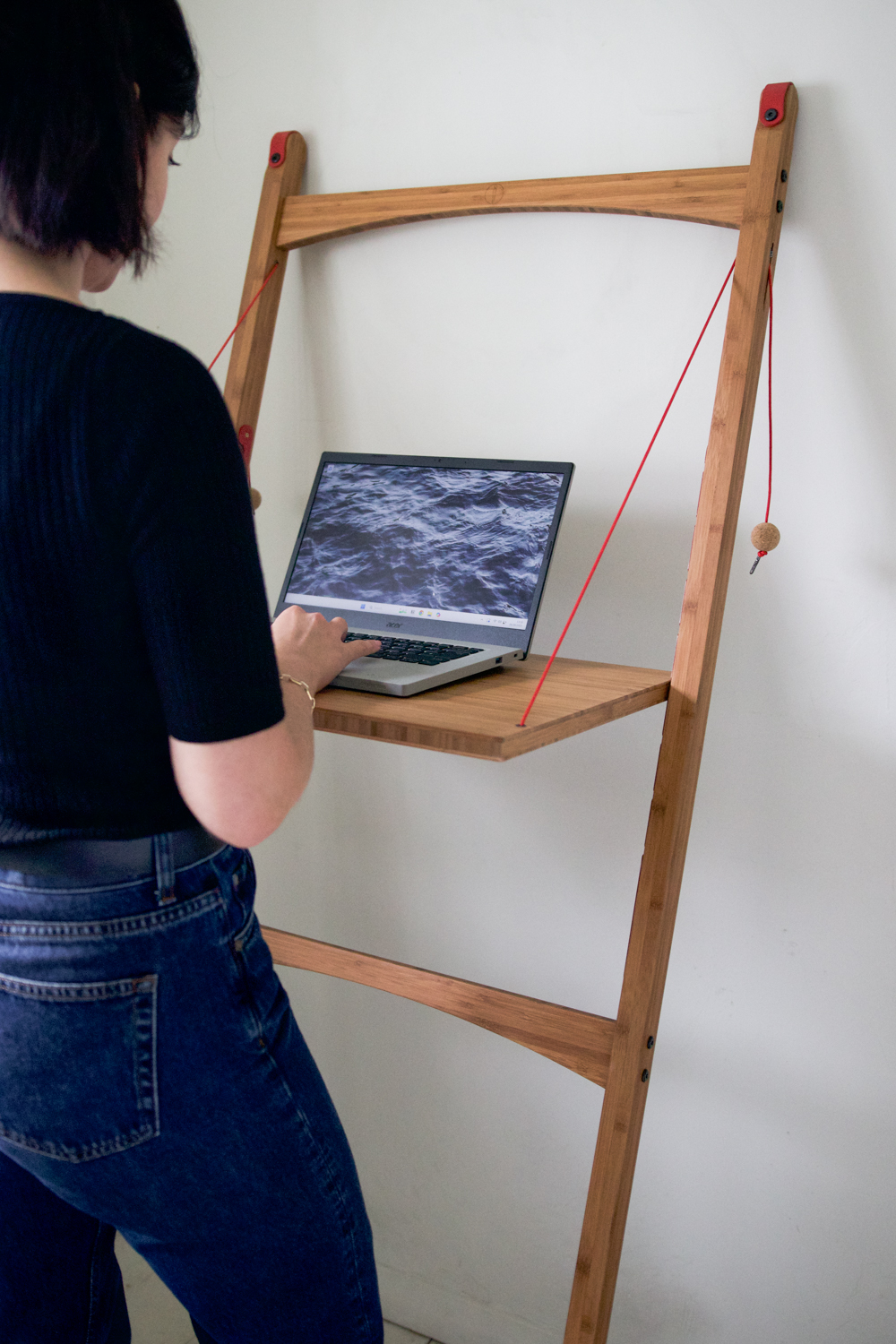 Besma using standing desk