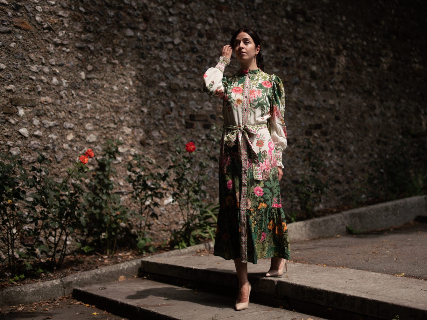 Besma walking, wearing the Carey Dress by Raishma